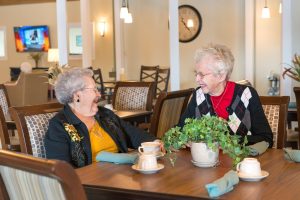Senior women dining and laughing
